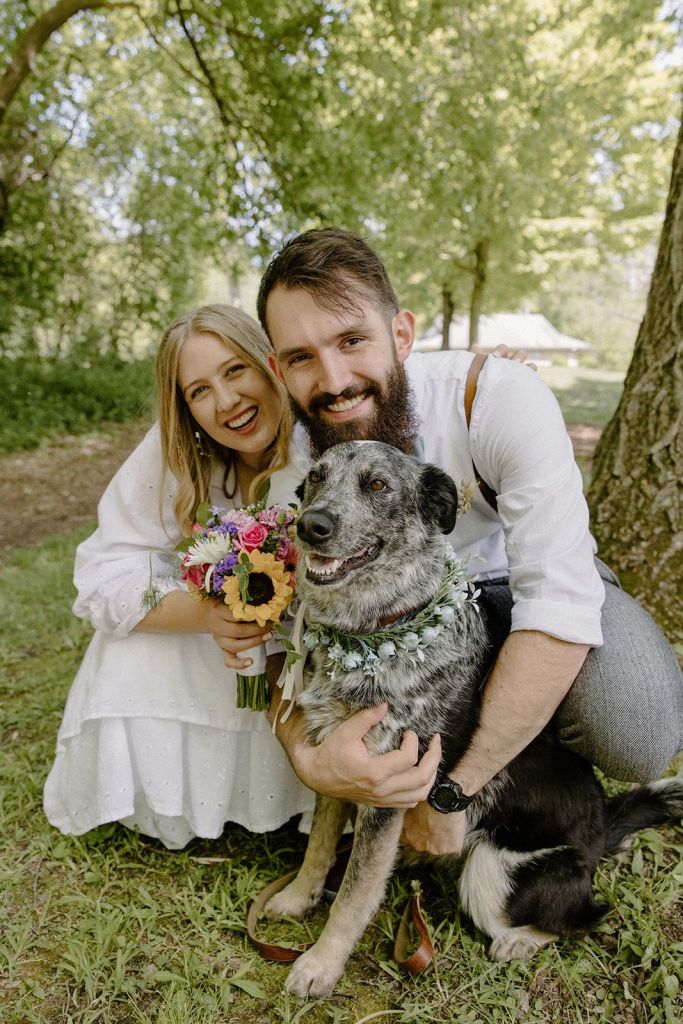 Couple and a dog at a wedding